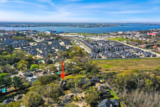 drone / aerial view with a residential view and a water view