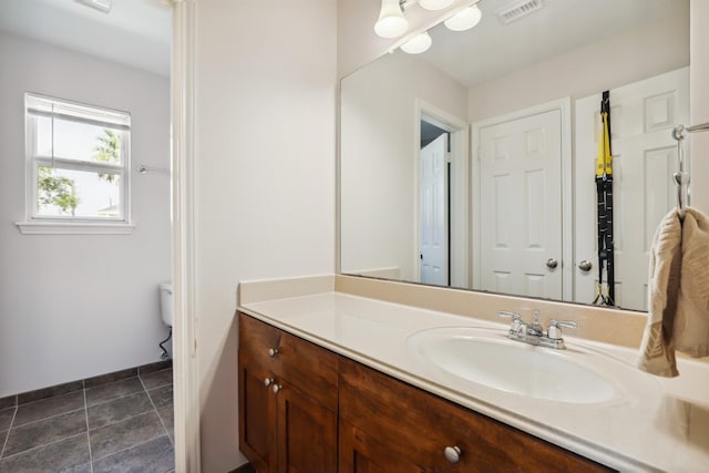 bathroom with vanity, tile patterned floors, toilet, and visible vents