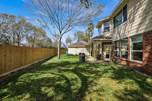 view of yard with a patio area and a fenced backyard