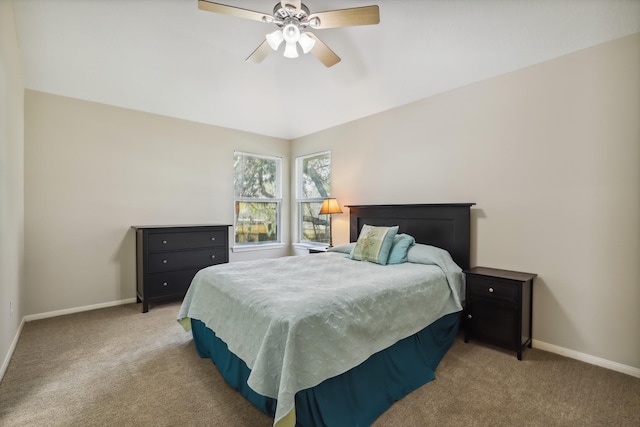 bedroom featuring ceiling fan, baseboards, and light carpet