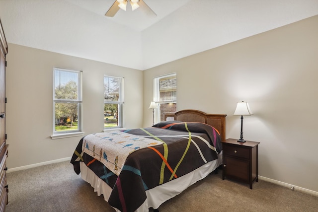 carpeted bedroom with ceiling fan, lofted ceiling, and baseboards