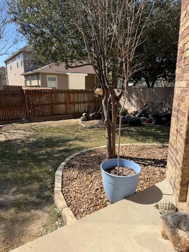 view of yard with a fenced backyard