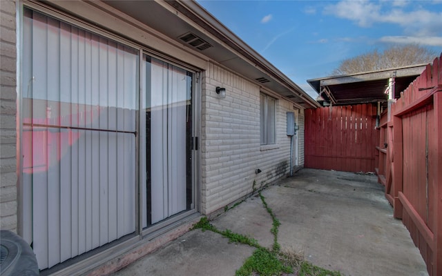 view of patio / terrace featuring fence