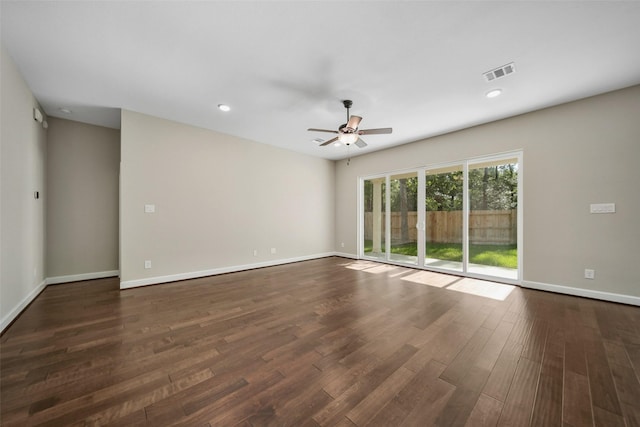 empty room with visible vents, dark wood-type flooring, a ceiling fan, recessed lighting, and baseboards