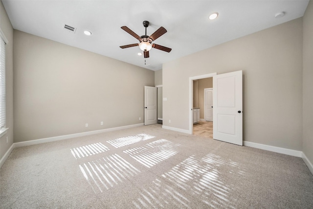 unfurnished bedroom with baseboards, visible vents, recessed lighting, ceiling fan, and light colored carpet