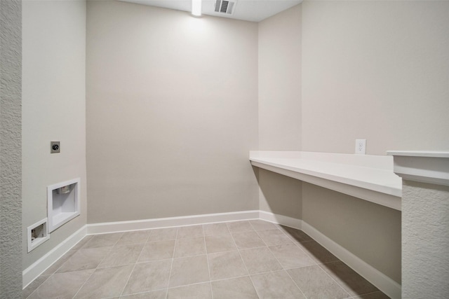 laundry room with light tile patterned floors, baseboards, visible vents, laundry area, and electric dryer hookup