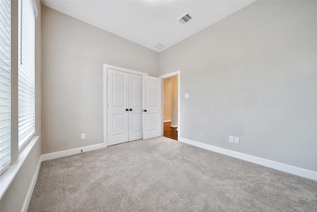 32193 Park Plains Dr, Conroe, TX 77385 - unfurnished bedroom featuring carpet flooring, baseboards, and a closet