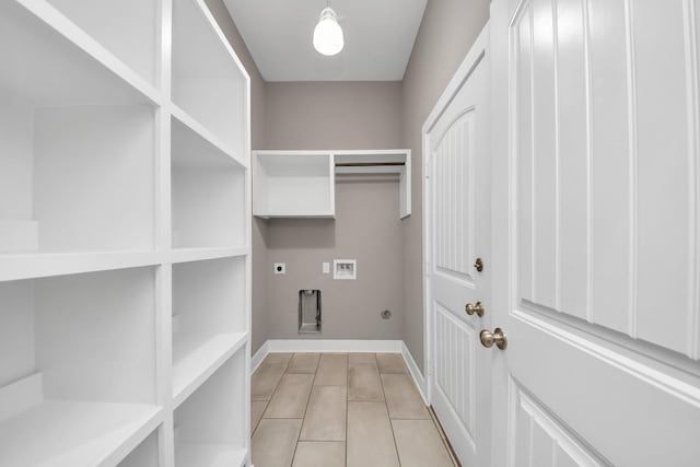 laundry room featuring hookup for a washing machine, baseboards, laundry area, electric dryer hookup, and hookup for a gas dryer