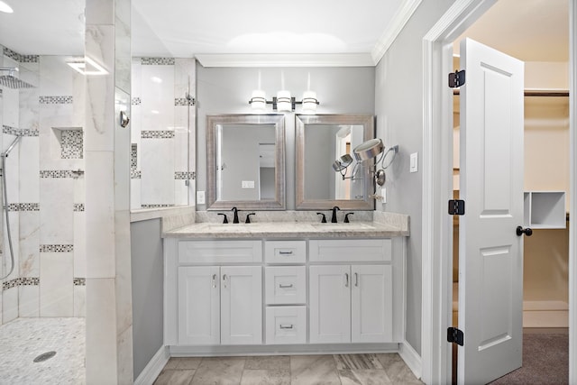 full bathroom featuring a sink, ornamental molding, and a shower stall