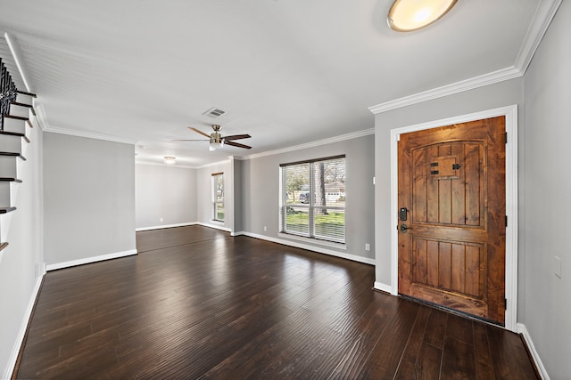 entryway featuring visible vents, crown molding, baseboards, dark wood-type flooring, and ceiling fan