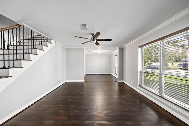 unfurnished living room featuring baseboards, ceiling fan, stairs, ornamental molding, and wood finished floors