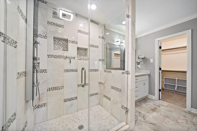 bathroom with vanity, baseboards, a stall shower, ornamental molding, and marble finish floor