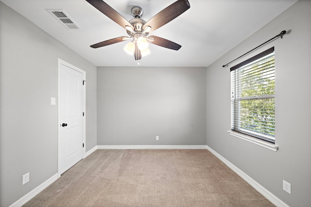 unfurnished room featuring visible vents, baseboards, ceiling fan, and carpet flooring