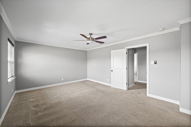 unfurnished room with baseboards, carpet floors, and a ceiling fan