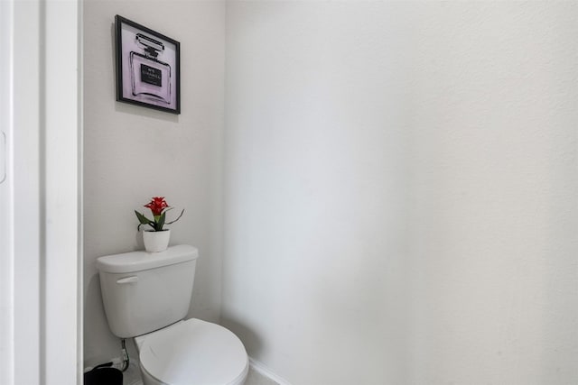 4502 Terrazza Verde Dr, Katy, TX 77493 - bathroom featuring baseboards and toilet