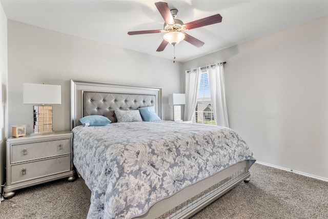 carpeted bedroom with a ceiling fan and baseboards