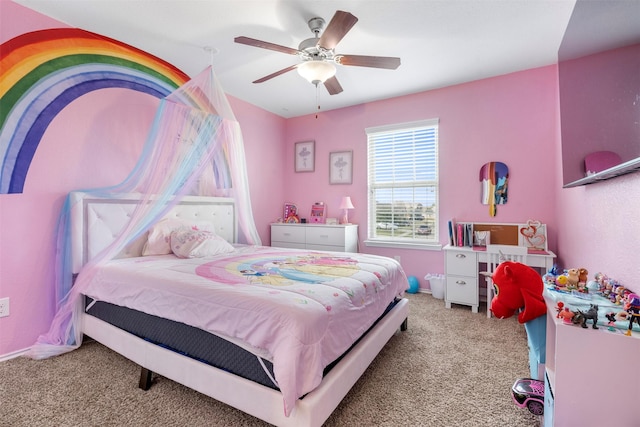 carpeted bedroom with baseboards and a ceiling fan