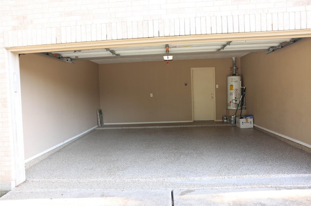 garage featuring gas water heater and baseboards