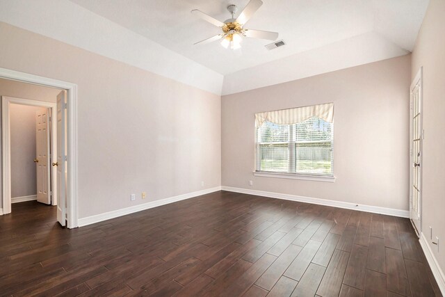 unfurnished room featuring visible vents, lofted ceiling, baseboards, ceiling fan, and dark wood-style flooring