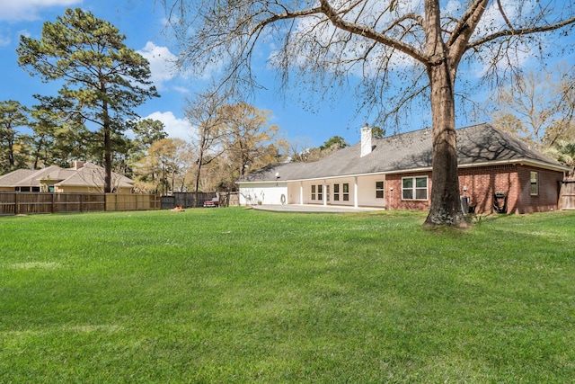 view of yard featuring a patio area and fence