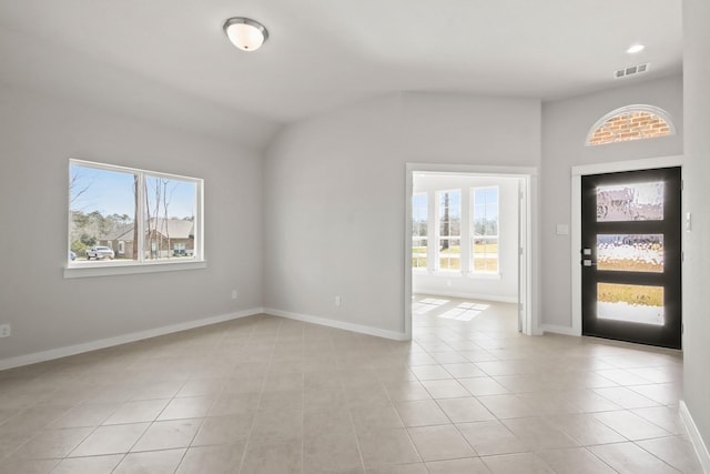 entryway featuring a wealth of natural light, visible vents, baseboards, and light tile patterned floors