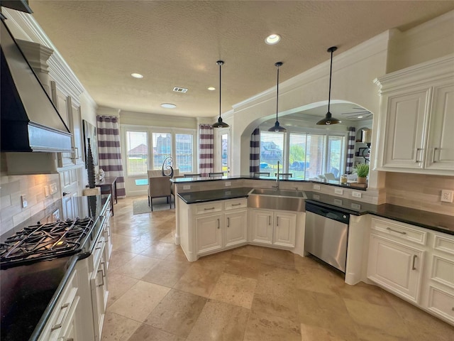 kitchen featuring custom range hood, a sink, dark countertops, arched walkways, and dishwasher