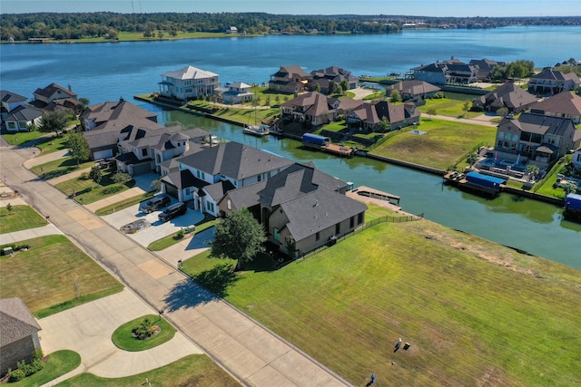 birds eye view of property featuring a residential view and a water view