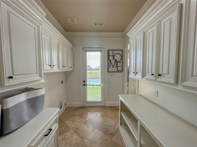 clothes washing area with visible vents, cabinet space, hookup for an electric dryer, and ornamental molding