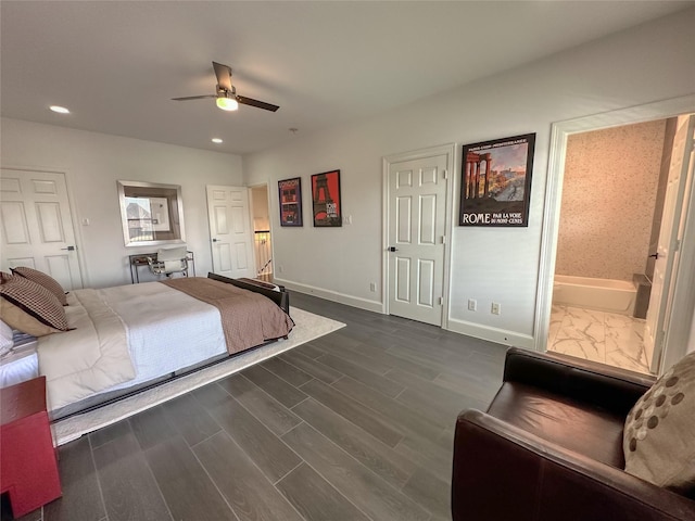 bedroom featuring dark wood finished floors, recessed lighting, connected bathroom, baseboards, and ceiling fan