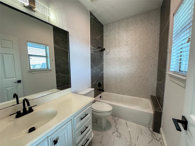 full bath with marble finish floor, vanity, bathing tub / shower combination, and toilet