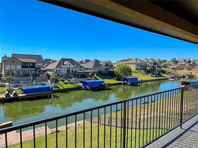 water view with a residential view and fence