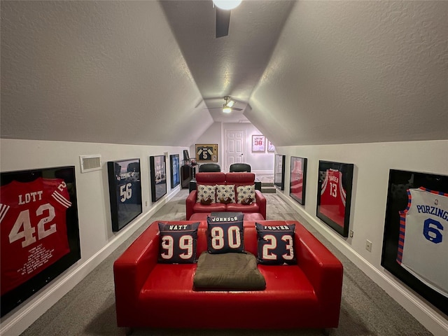 rec room with visible vents, carpet floors, a textured ceiling, and lofted ceiling