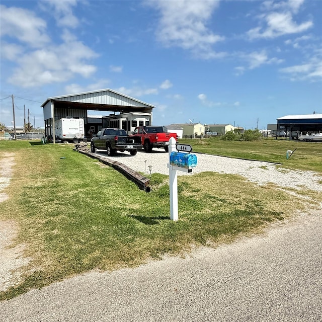 view of car parking featuring gravel driveway