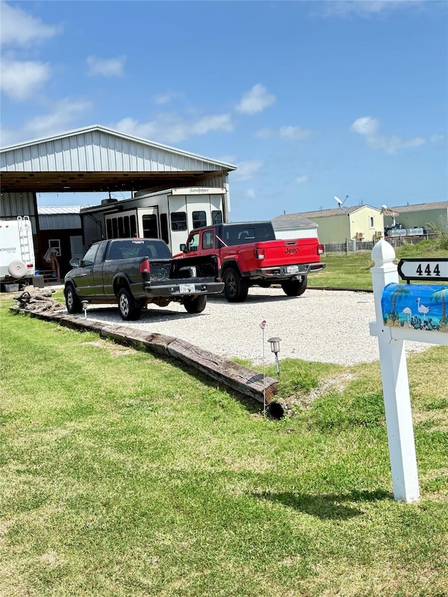 view of vehicle parking featuring a detached carport