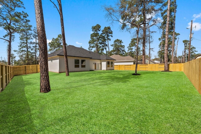 view of yard featuring a fenced backyard