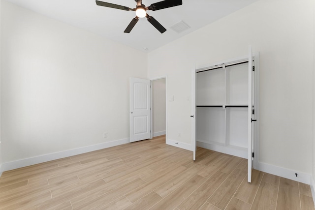 unfurnished bedroom with visible vents, a closet, light wood-style floors, baseboards, and ceiling fan