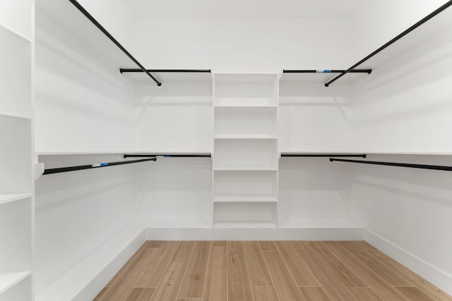 spacious closet featuring wood finished floors