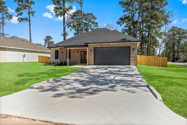 view of front of home featuring fence, driveway, a front lawn, a garage, and brick siding