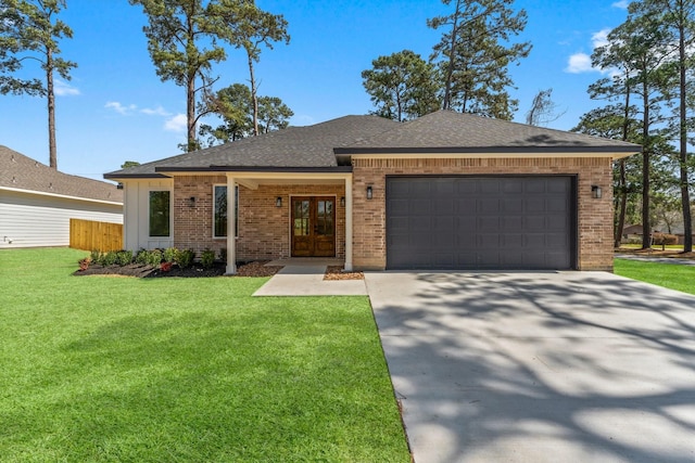 view of front facade with brick siding, concrete driveway, a front yard, roof with shingles, and a garage