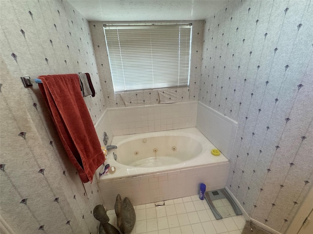 bathroom featuring wallpapered walls, tile patterned floors, and a tub with jets