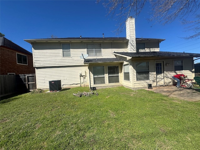 back of house featuring a lawn, a patio, central AC, and fence