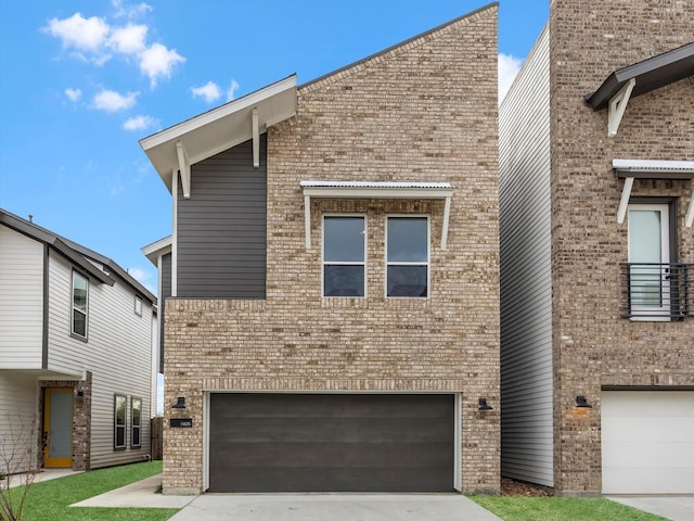 view of front of property with concrete driveway, an attached garage, and brick siding