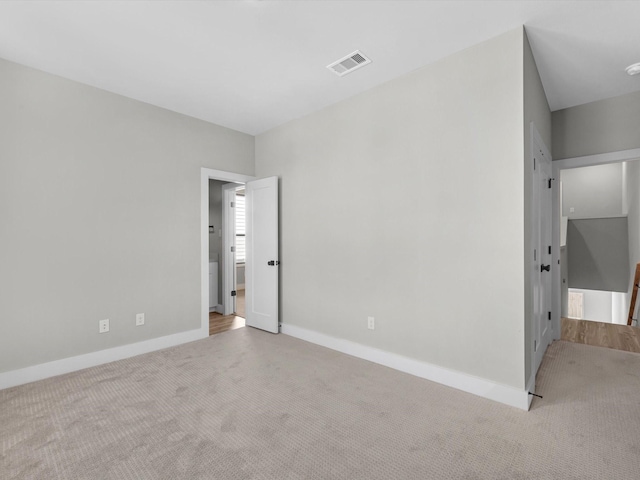 unfurnished bedroom with visible vents, baseboards, and carpet floors