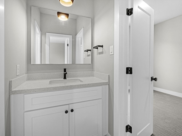 bathroom featuring vanity and baseboards