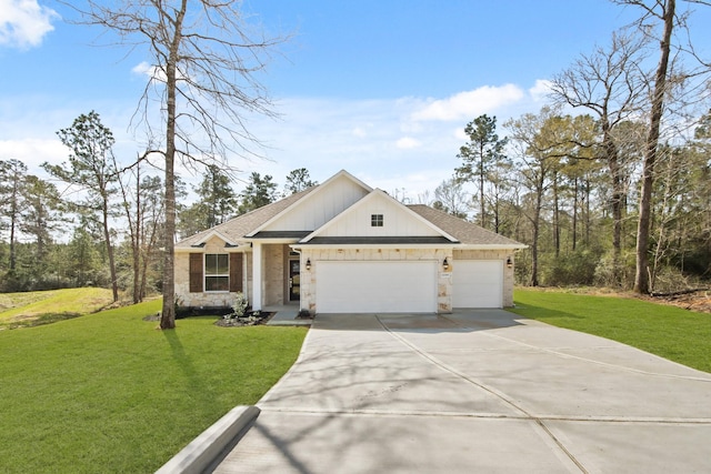 view of front of property with stone siding, driveway, a front yard, and a garage