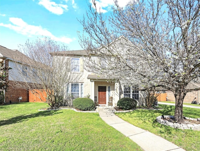 view of front of home featuring brick siding and a front lawn