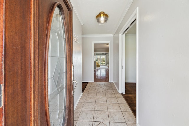 corridor with light tile patterned flooring, baseboards, and ornamental molding