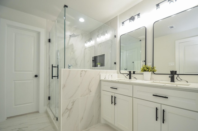 bathroom with visible vents, marble finish floor, a sink, a marble finish shower, and double vanity