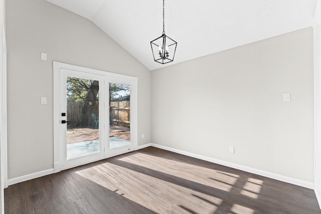 unfurnished dining area featuring baseboards, lofted ceiling, a notable chandelier, and dark wood-style floors