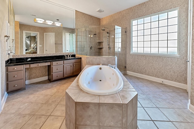 full bathroom featuring vanity, a tub with jets, tiled shower, wallpapered walls, and tile patterned floors